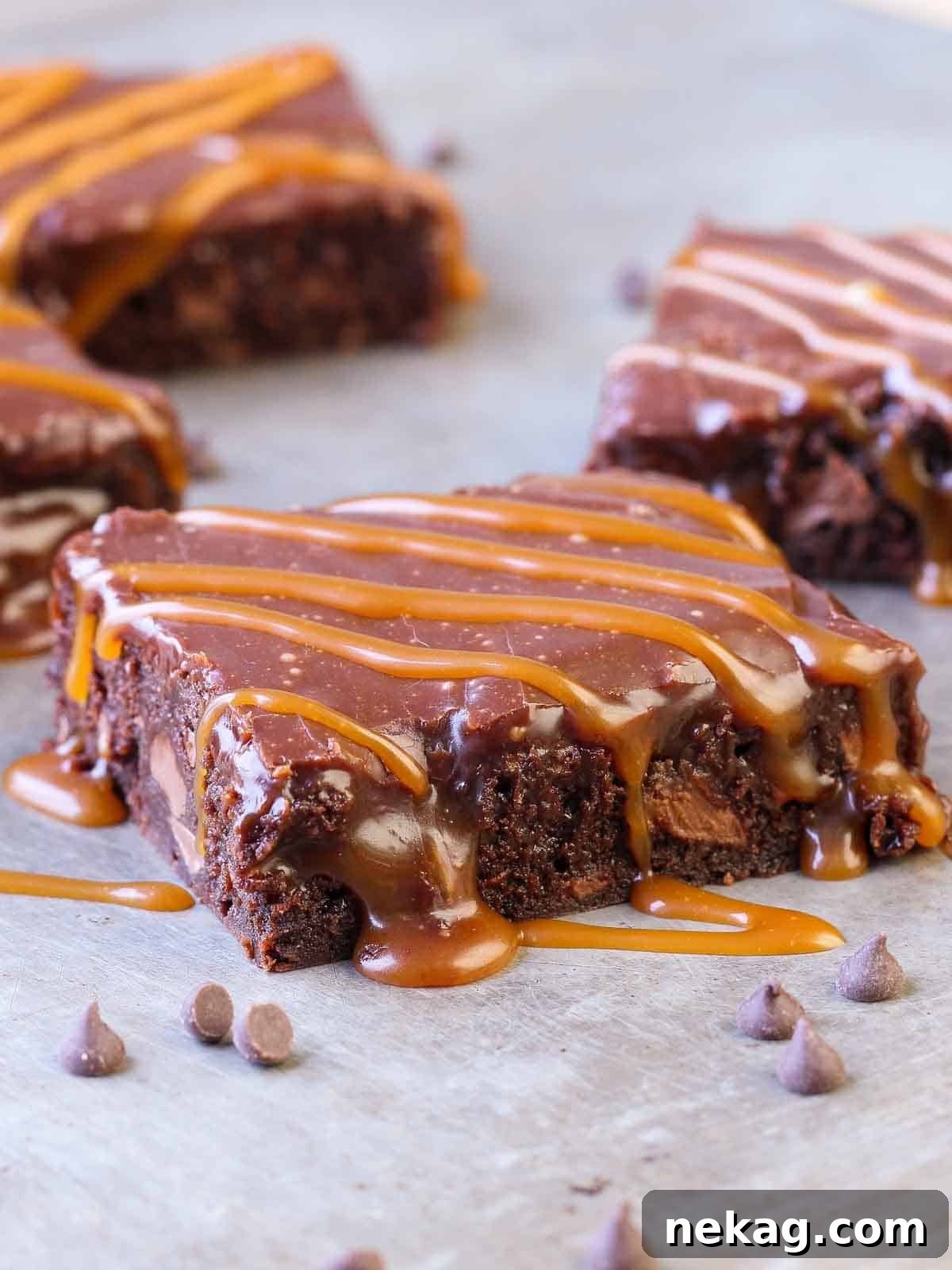 Decadent Caramel Brownies 2 Intensely fudgy caramel brownies with visible swirls of salted caramel and a glistening Baileys ganache topping.