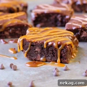 Decadent Caramel Brownies 7 A top-down view of a rich salted caramel brownie, perfectly cut with visible caramel swirls and a smooth chocolate ganache.