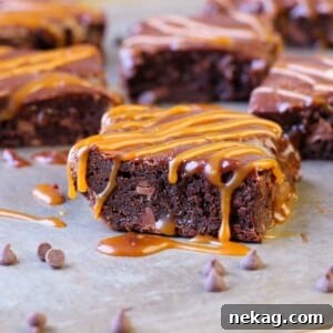 Close-up of a perfectly cut caramel brownie, showcasing its fudgy interior and caramel swirls.