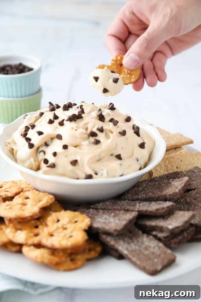 Decadent Buckeye Dip 4 Peanut Butter Buckeye Dip served with pretzels and honey and chocolate graham crackers.