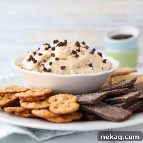This buckeye dip recipe with cream cheese and mini chocolate chips is an easy, smooth, and creamy dip fashioned after buckeye peanut butter balls.