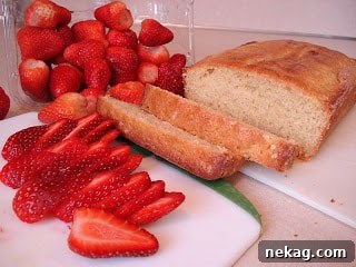 Slices of pound cake topped with fresh strawberries