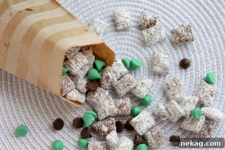 A bowl of freshly made Mint Truffle Muddy Buddies, ready to be enjoyed.