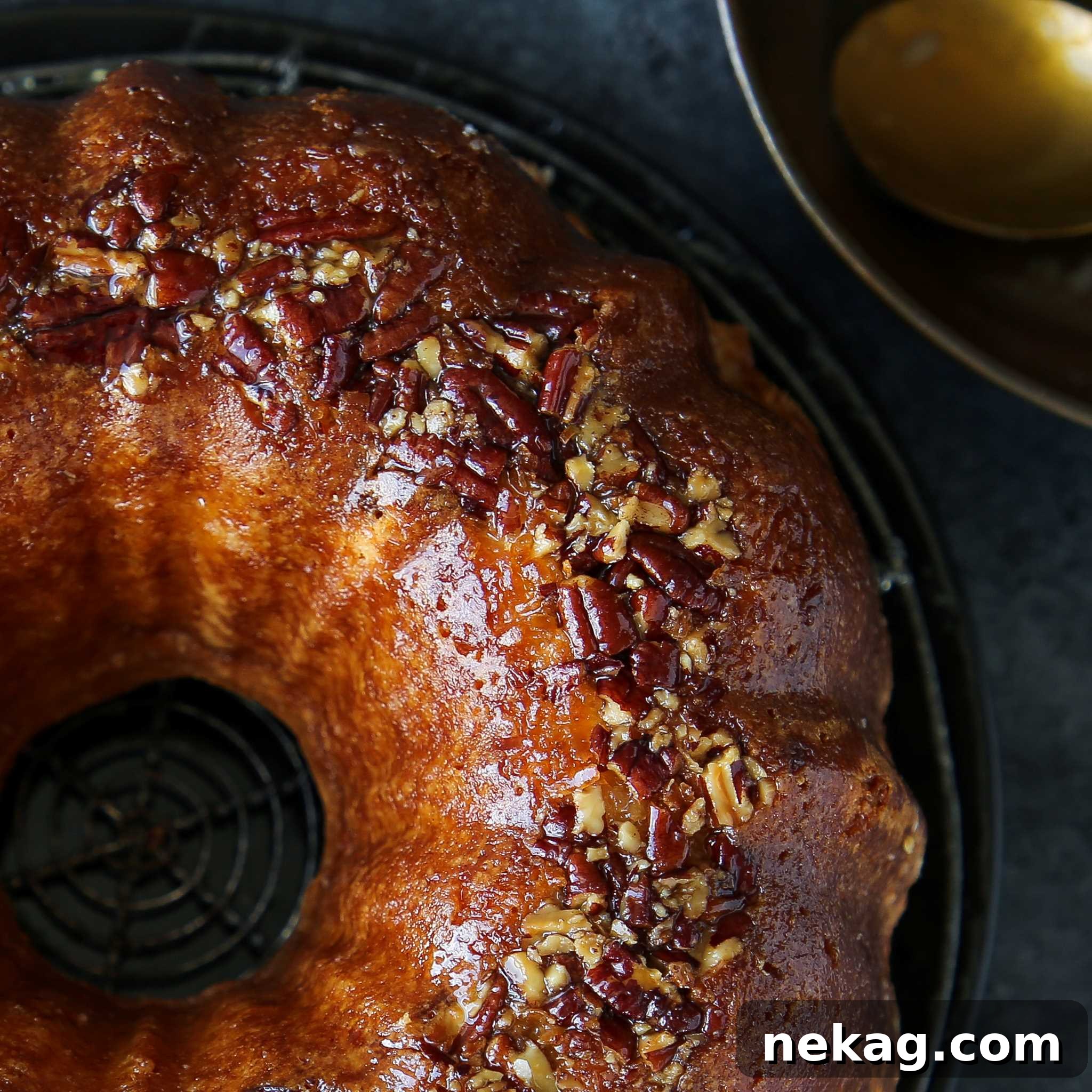 Spirited Bacardi Delight 4 Bacardi Rum Cake closeup, highlighting the crunchy pecans and coconut on top.