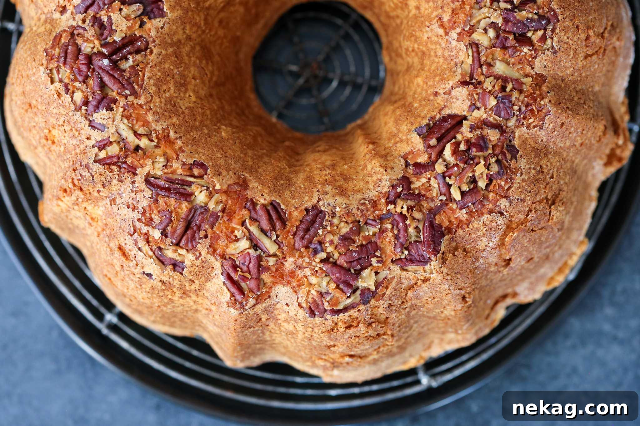 Spirited Bacardi Delight 5 Unglazel rum cake on a cooling rack, showcasing its golden-brown crust and perfect Bundt shape.