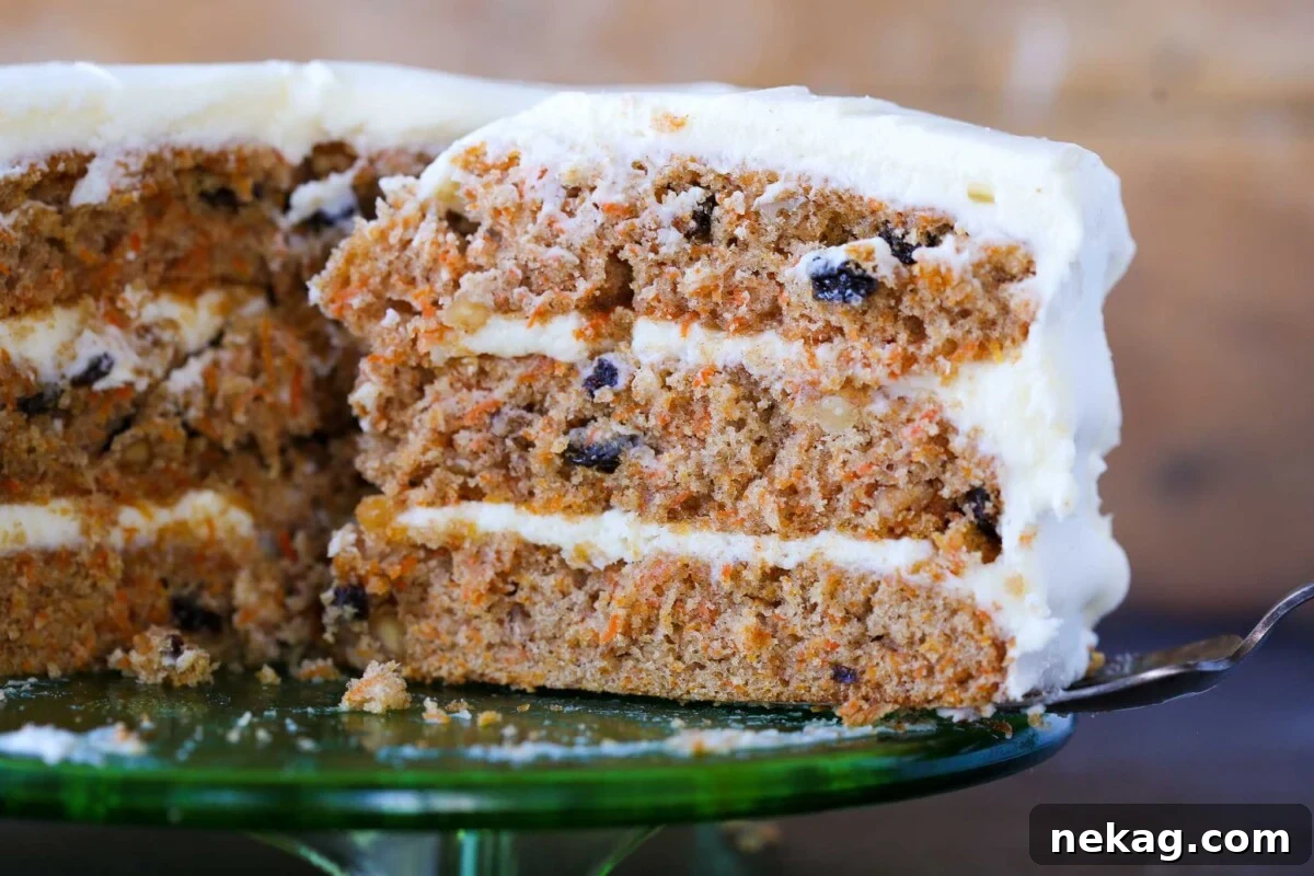 The fluffy, moist interior of an easy carrot cake, showing visible carrot shreds and nuts.