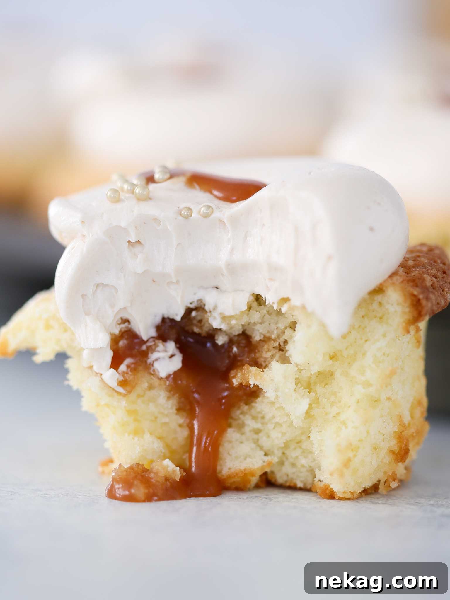 Decadent Caramel Core Cupcakes Bitten to Reveal Gooey Center