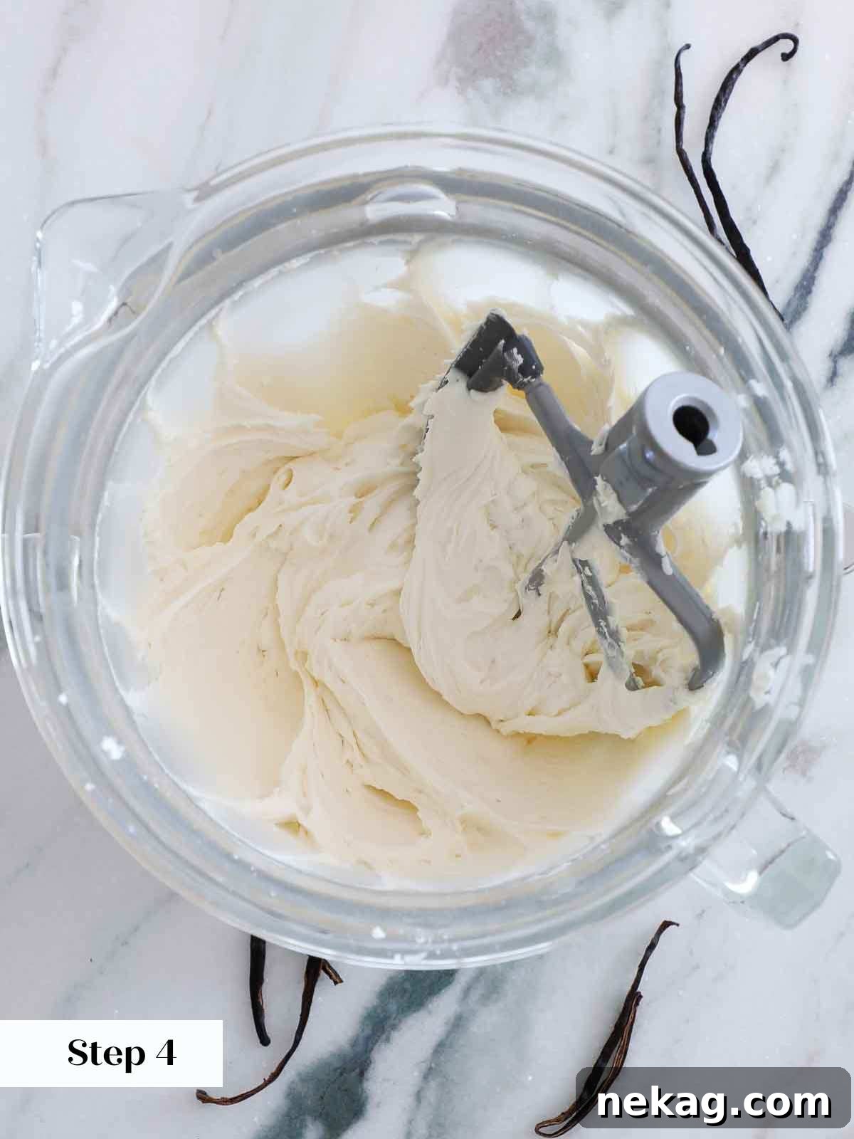 Perfectly smooth and creamy American buttercream in a mixer bowl, ready for whipping.
