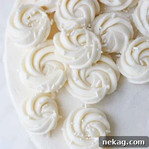 Detailed view of elegant rosettes piped with creamy American buttercream, perfect for cake decoration.