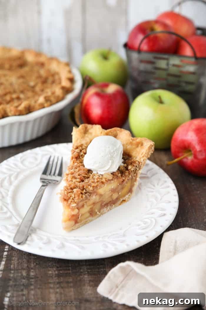 Golden Apple Crumb Delight 2 A beautifully baked Dutch Apple Pie, showcasing its golden streusel topping and traditional crust, ready to be served as a delicious holiday dessert.