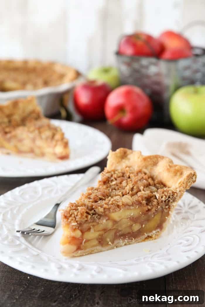 Golden Apple Crumb Delight 4 Dutch Apple Pie, a perfect fusion of classic apple pie and apple crisp, featuring a crisp streusel topping and a rich apple filling, ideal for holiday gatherings.