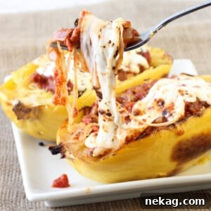 Top-down view of Twice Baked Spaghetti Squash with turkey sausage and melted mozzarella