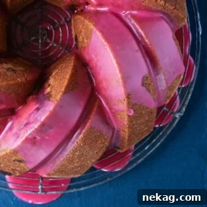 Cherry Almond Pound Cake with pink cherry glaze dripping
