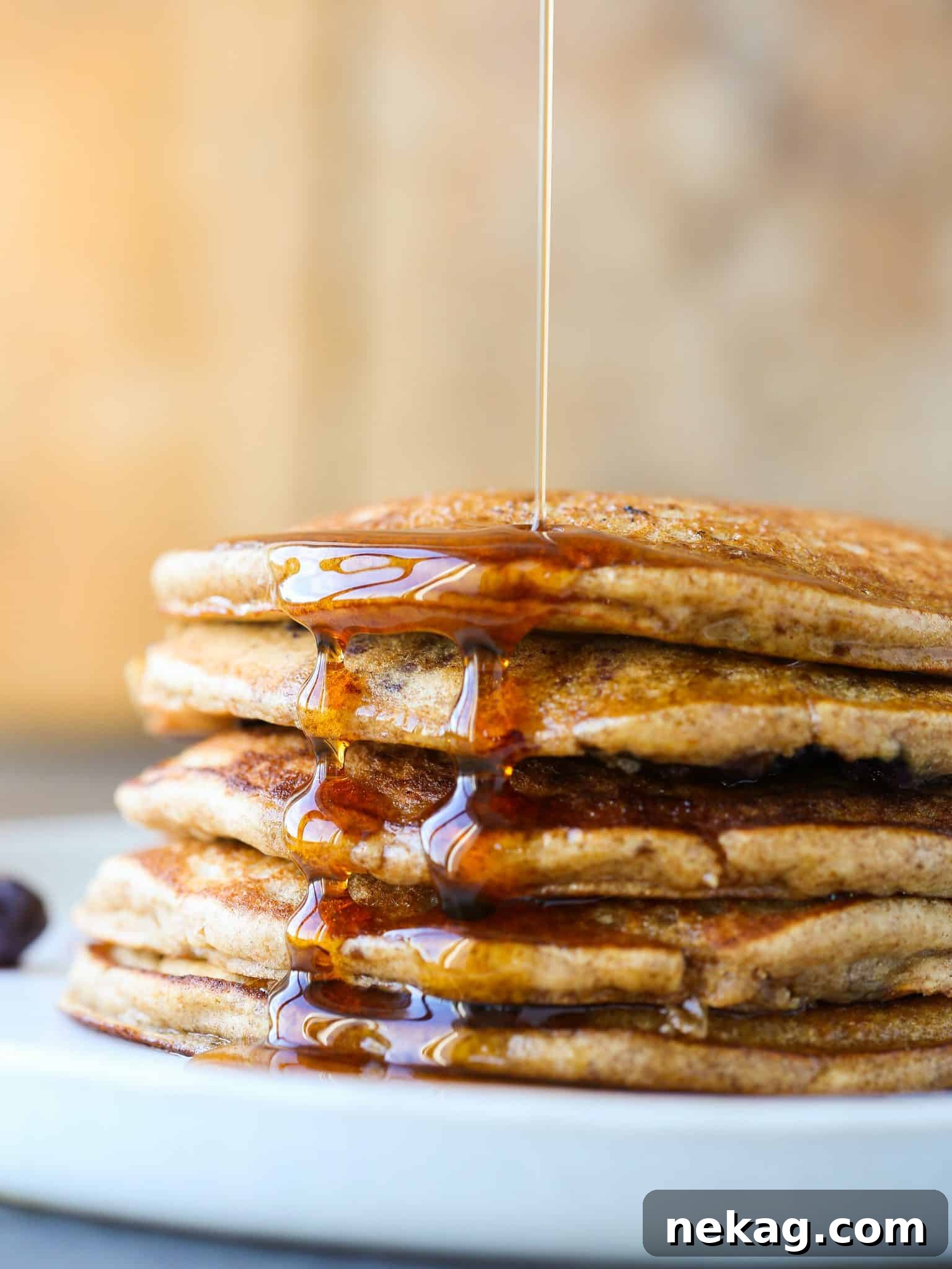 Close-up of golden whole wheat pancakes with berries