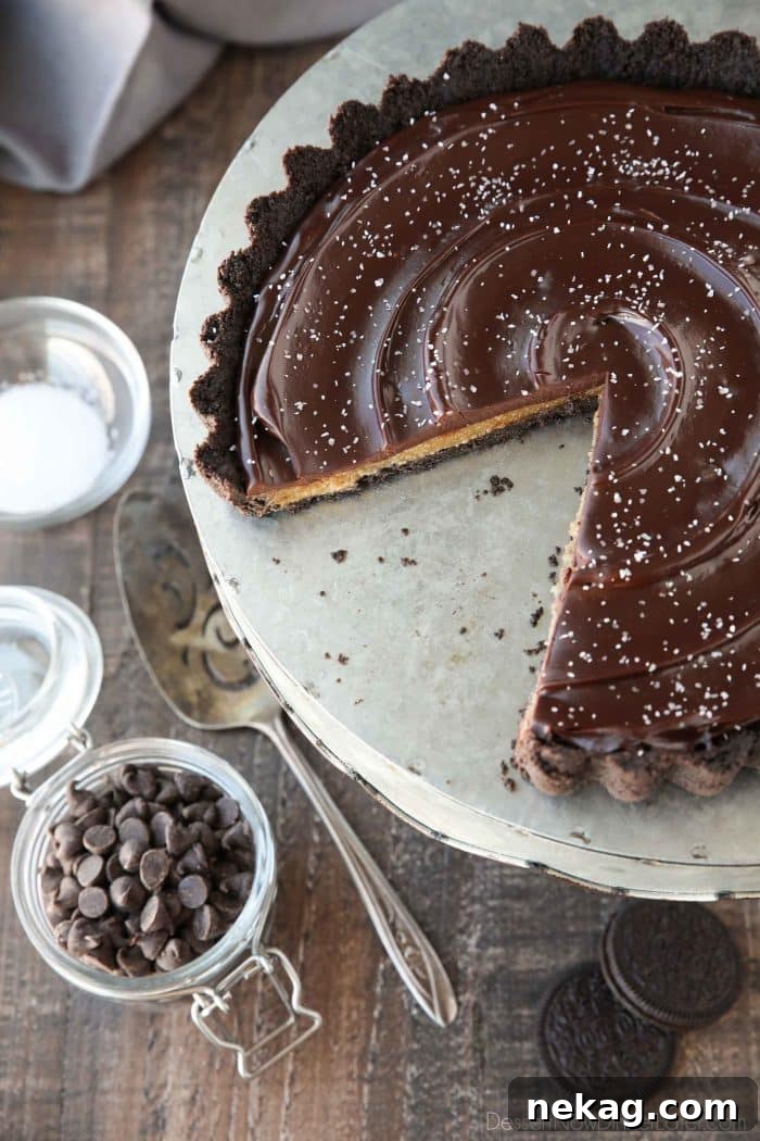 Decadent Chocolate Caramel Tart with a flaky salt finish, perfect for dessert lovers.