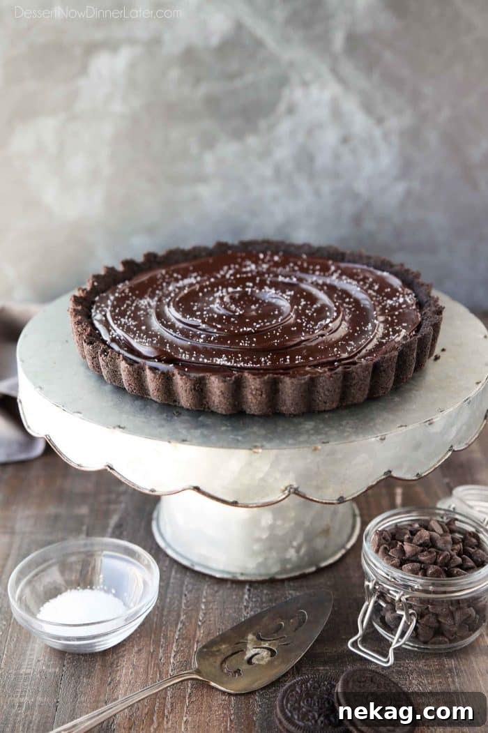 A chocolate lover's dream: easy Chocolate Caramel Tart with Oreo crust, soft caramel filling, and creamy chocolate ganache.
