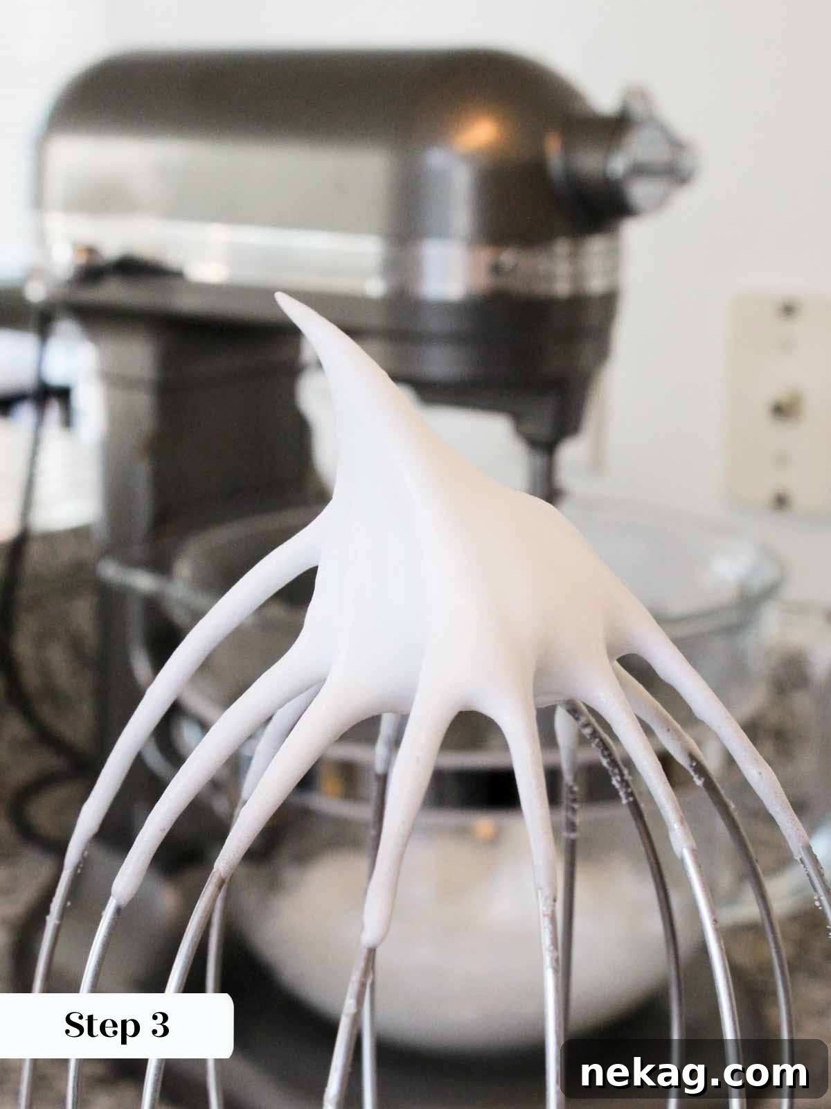 Perfectly whipped stiff peaks on meringue, ready for the sugar syrup.