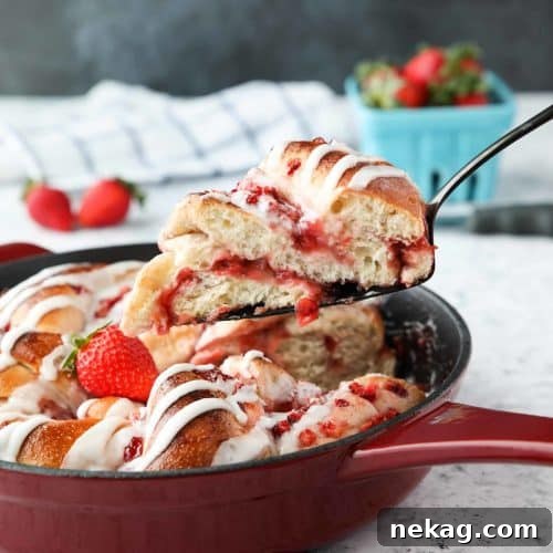 Layers of fruit and jam are all twisted up in this Strawberry Swirl Bread, topped with a sweet glaze.