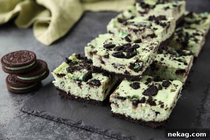 Mint Cookies and Cream Cheesecake Bars 5 Several Mint Oreo Cheesecake Bars arranged on a serving plate.