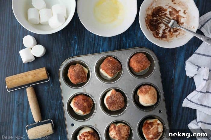 Place prepared resurrection rolls into a greased muffin tin.