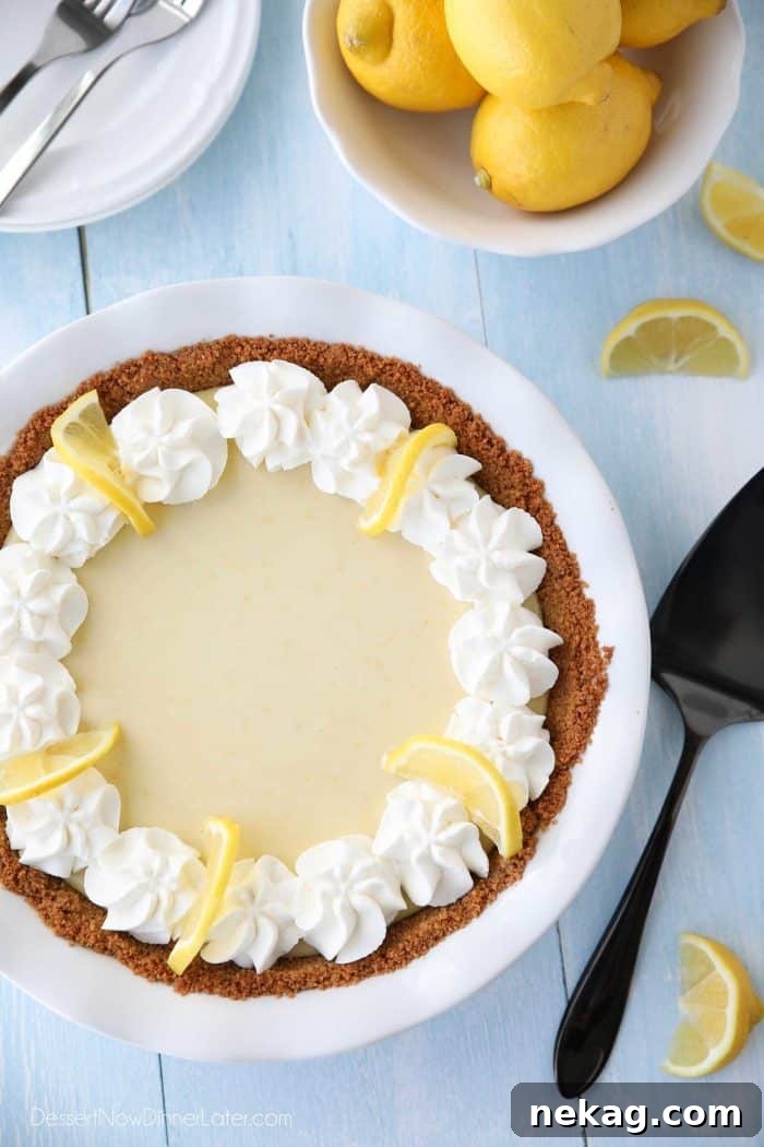 Lemon Cream Pie with whipped cream, an excellent alternative to Lemon Meringue Pie, offering a tangy and balanced flavor.