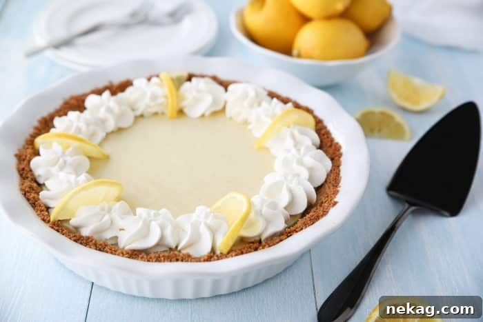 Lemon Pie filling, creamy from sweetened condensed milk and tangy with fresh lemon juice and zest, baking in a graham cracker crust.