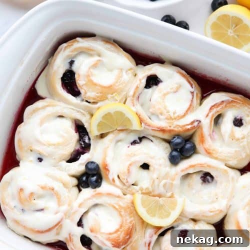 Lemon Blueberry Sweet Rolls are made easy with store-bought bread dough, a sticky lemon filling, fresh blueberries, and a tangy lemon cream cheese frosting.