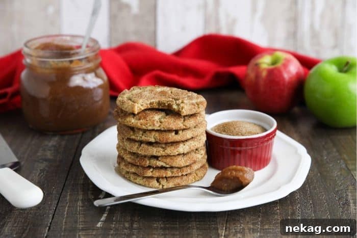 Apple Butter Cookies Video Recipe 8 Cookies stacked on a plate with a bite taken out of the cookie on top.