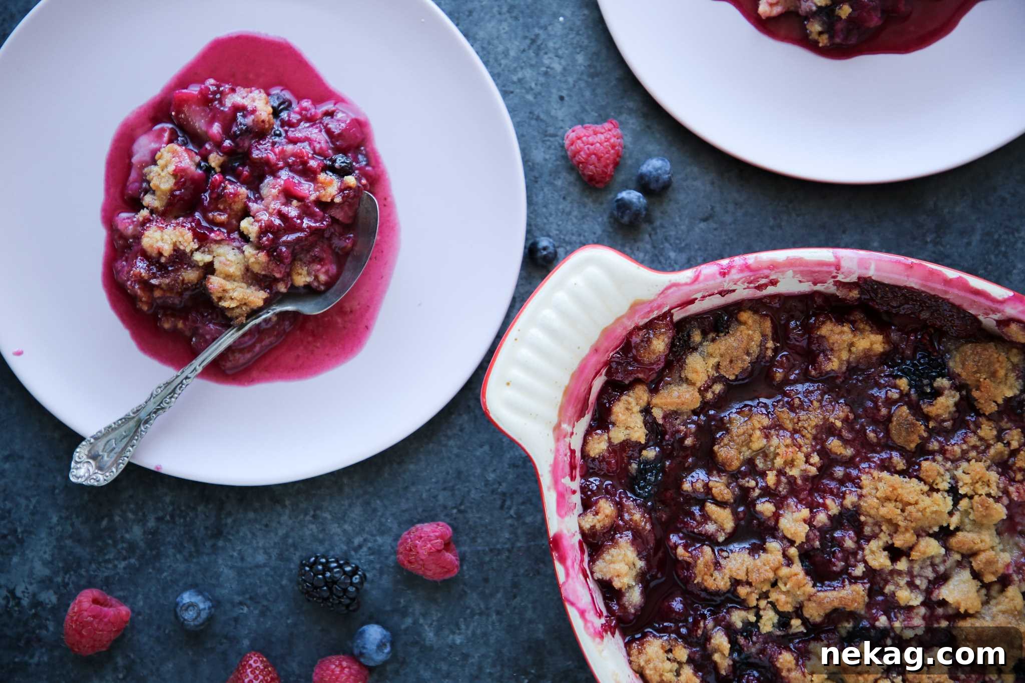 Warm Berry Crumble Bliss 4 A close-up of mixed berry crumble with fresh berries scattered around the dish, highlighting the rustic appeal.