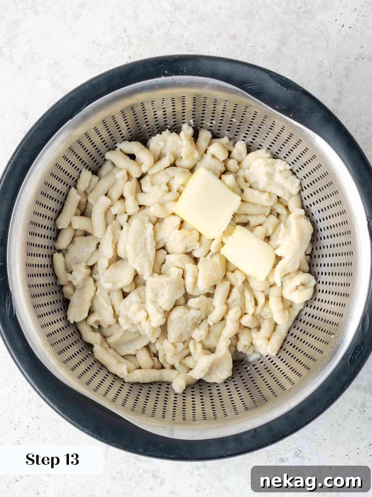 Classic Hungarian Chicken Paprikash 12 spaetzle in colander with butter.