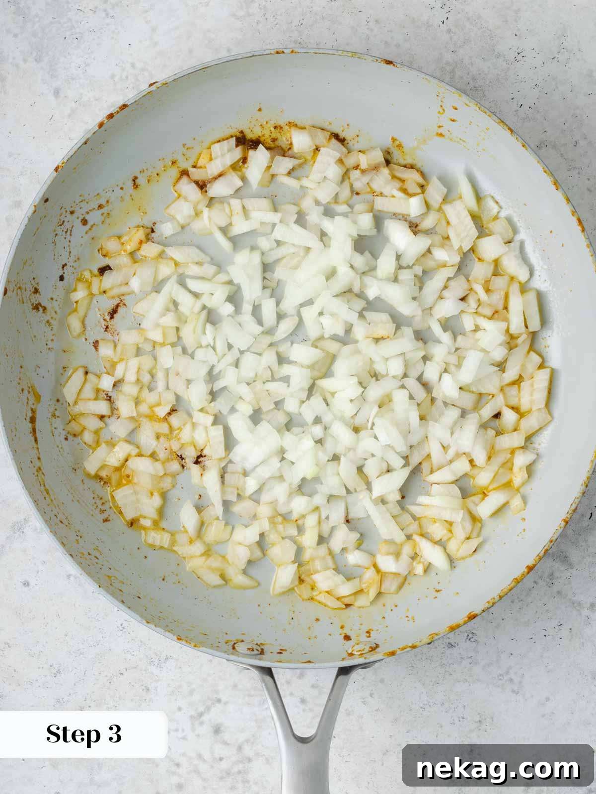 Classic Hungarian Chicken Paprikash 6 Onions chopped in pan with butter.