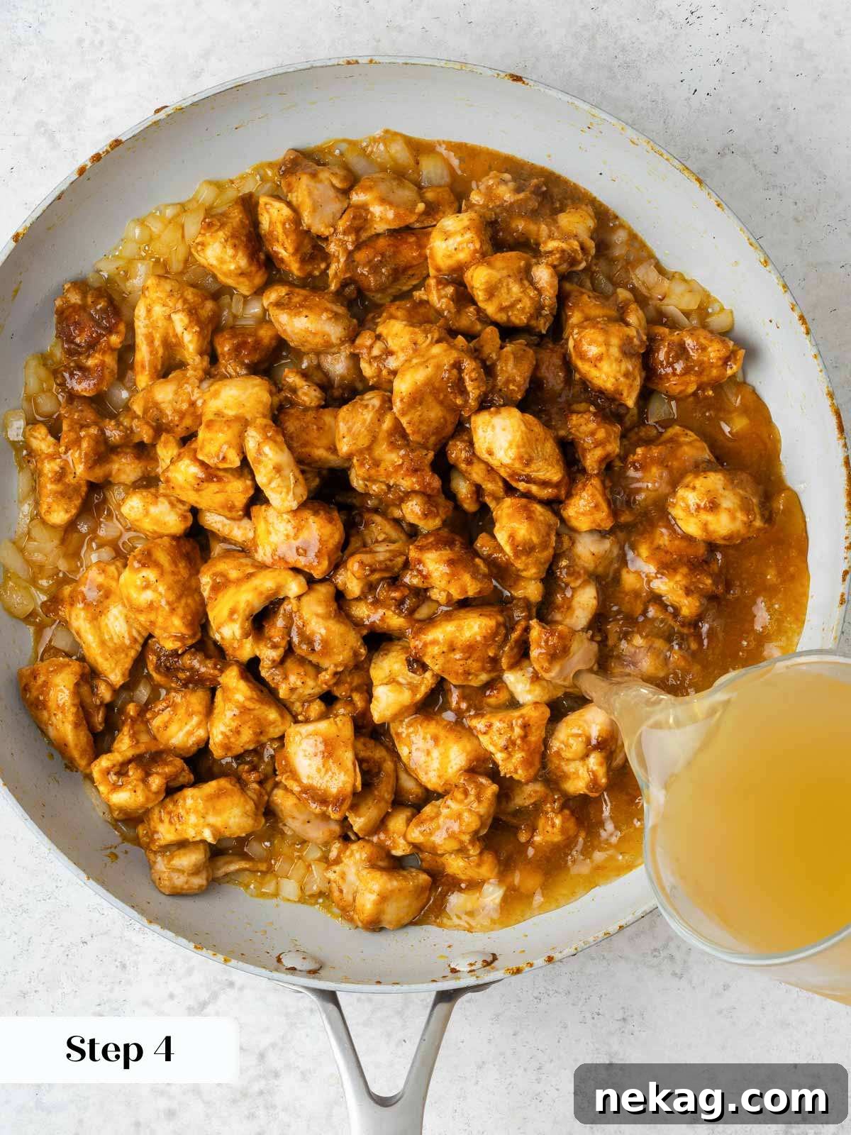 Classic Hungarian Chicken Paprikash 7 chicken paprikash adding chicken stock.