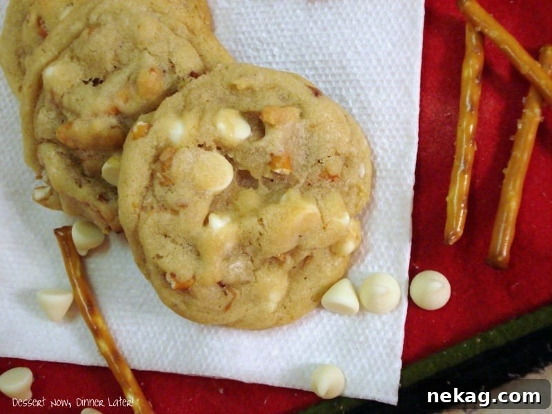 White Chocolate Pretzel Cookies 3 Close-up of freshly baked Pretzel White Chocolate Chip Cookies, showing the melted white chocolate and crisp pretzel bits.