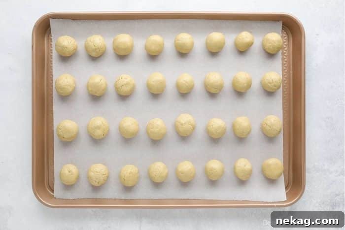 No-Bake Peanut Butter Truffles 7 Peanut Butter Balls shaped on a tray, ready to be dipped in chocolate.