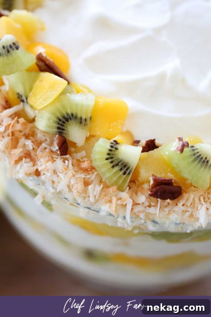 Overhead view of Tropical Trifle, garnished with fresh fruit and toasted coconut.