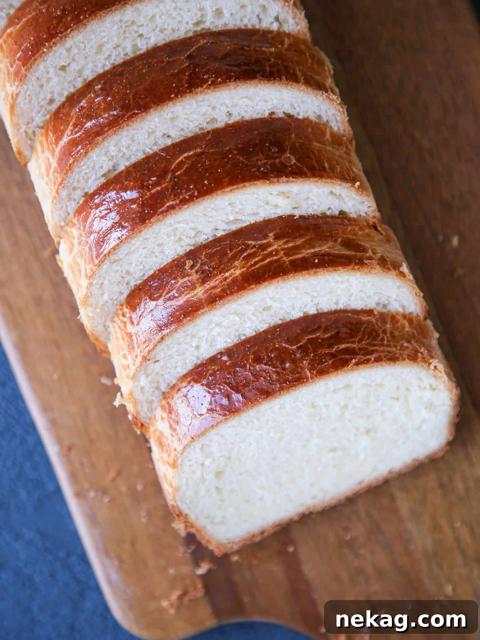 Sliced brioche bread, showcasing its tender, golden crumb.