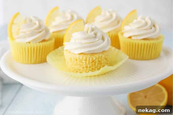 Zesty Lemon Cupcake Delight 5 Cake plate full of lemon cupcakes with cream cheese frosting.