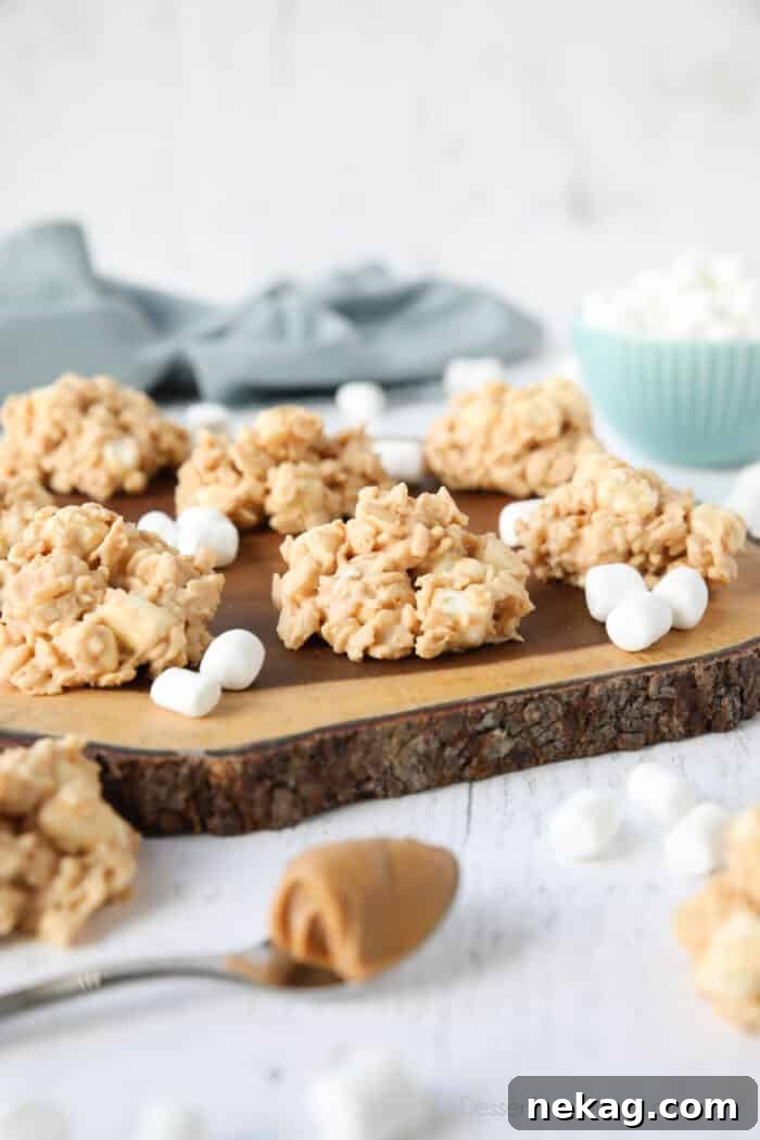 Indulgent Overload Cookies 4 Close-up focus on a bowl of crispy rice cereal, mini marshmallows, white chocolate, and peanut butter – the four core ingredients for Avalanche Cookies.