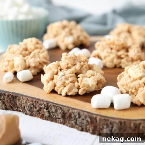Indulgent Overload Cookies 9 Close up of no-bake rice krispie treat cookies made with white chocolate, peanut butter, and marshmallows.