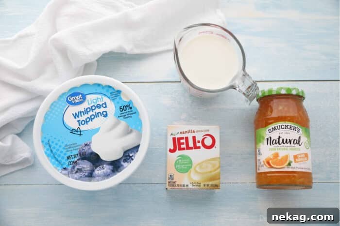 Orange Creamsicle Dream Cake 8 Ingredients for the creamy vanilla topping: instant vanilla pudding mix, thawed whipped topping, milk, and a jar of orange marmalade.