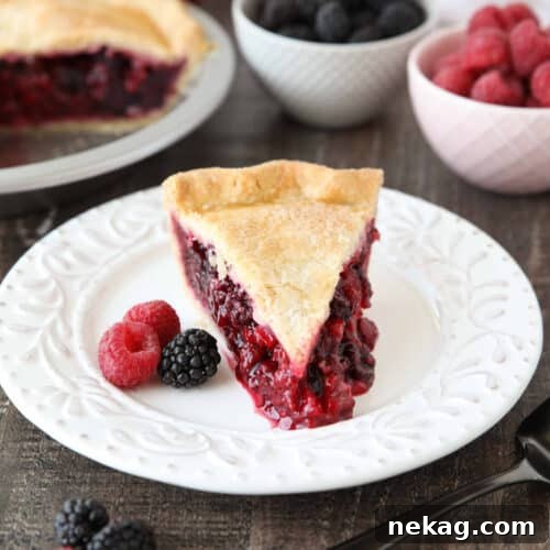 Slice of Razzleberry Pie on a plate. Focusing on the berry pie filling.