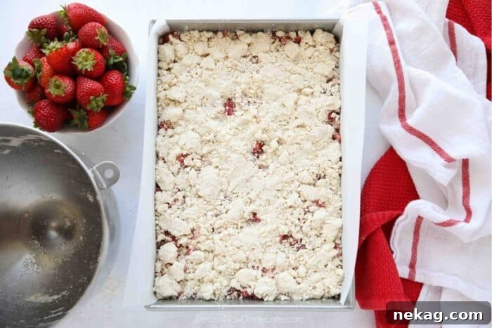 Buttery Strawberry Streusel Bars 9 The remaining crumb streusel mixture sprinkled evenly over the top of the strawberry filling, before baking.