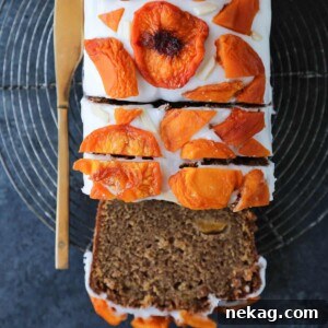Beautifully glazed Peach Loaf Cake with dried peach decoration.