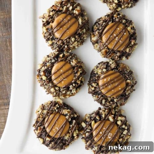 Turtle Thumbprint Cookies on long white rectangle platter, visually representing the final recipe, ready to be served.
