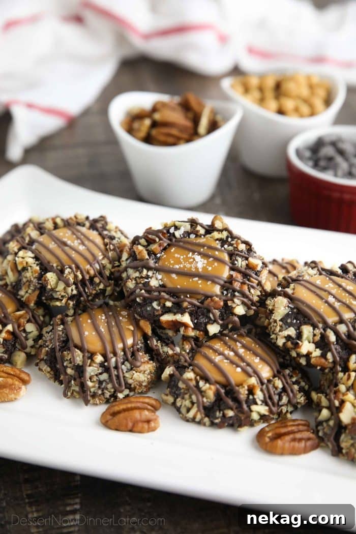 Delicious Turtle Thumbprint Cookies 3 Platter of perfectly stacked turtle thumbprint cookies, highlighting their intricate design and festive presentation for holiday gatherings.