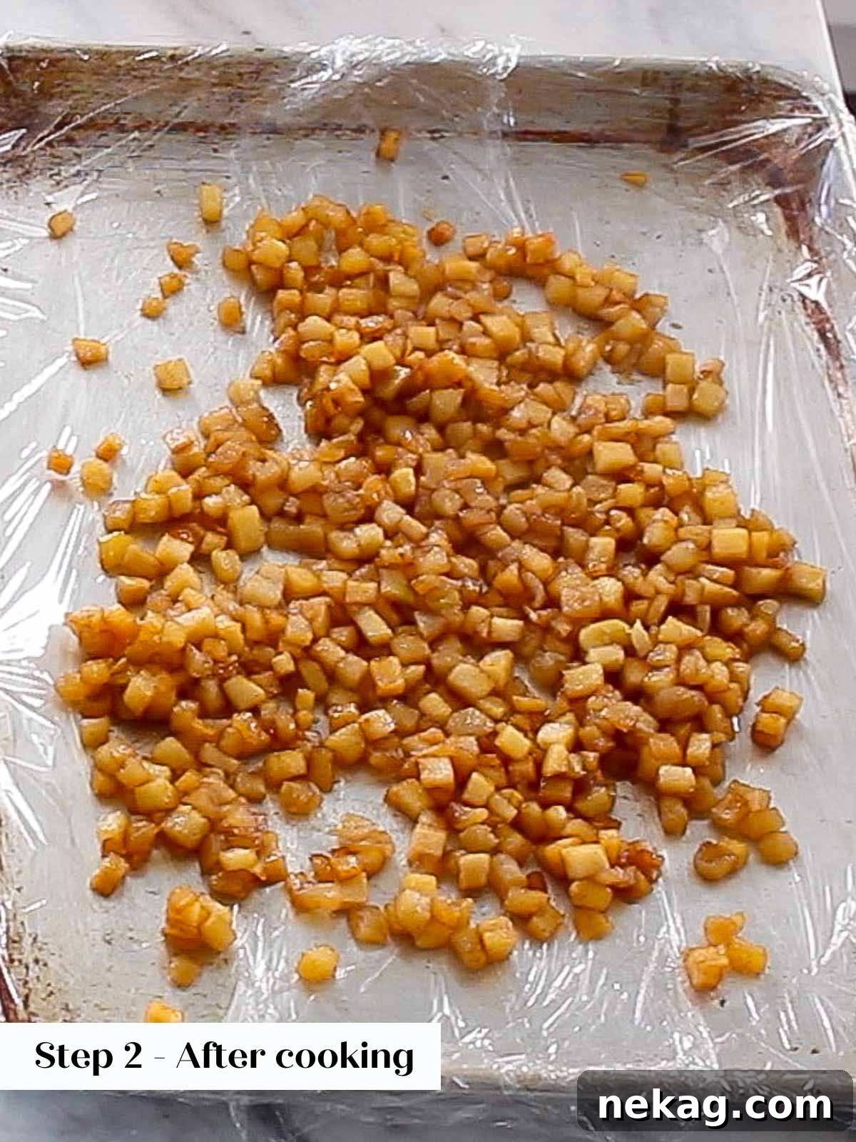 Warm apple filling spread in a single layer on a parchment-lined baking sheet to cool quickly.