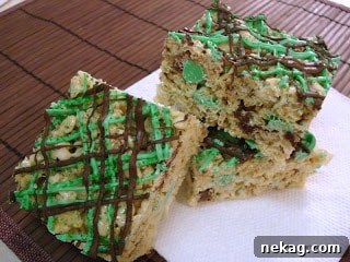 Mint chocolate krispie squares arranged on a serving plate, ready to be enjoyed.