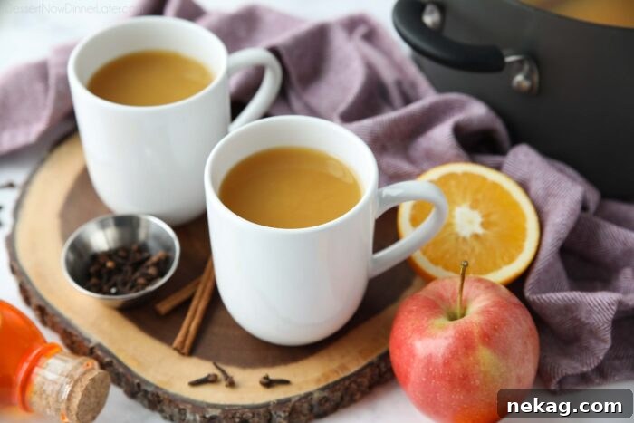 Festive Wassail Brew 6 Multiple mugs filled with steamy wassail, ready to be enjoyed.