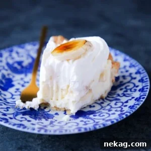 Golden Banana Delight 5 Banana Cream Pie cut with fork tine marks and layered with pastry cream, highlighting layers.