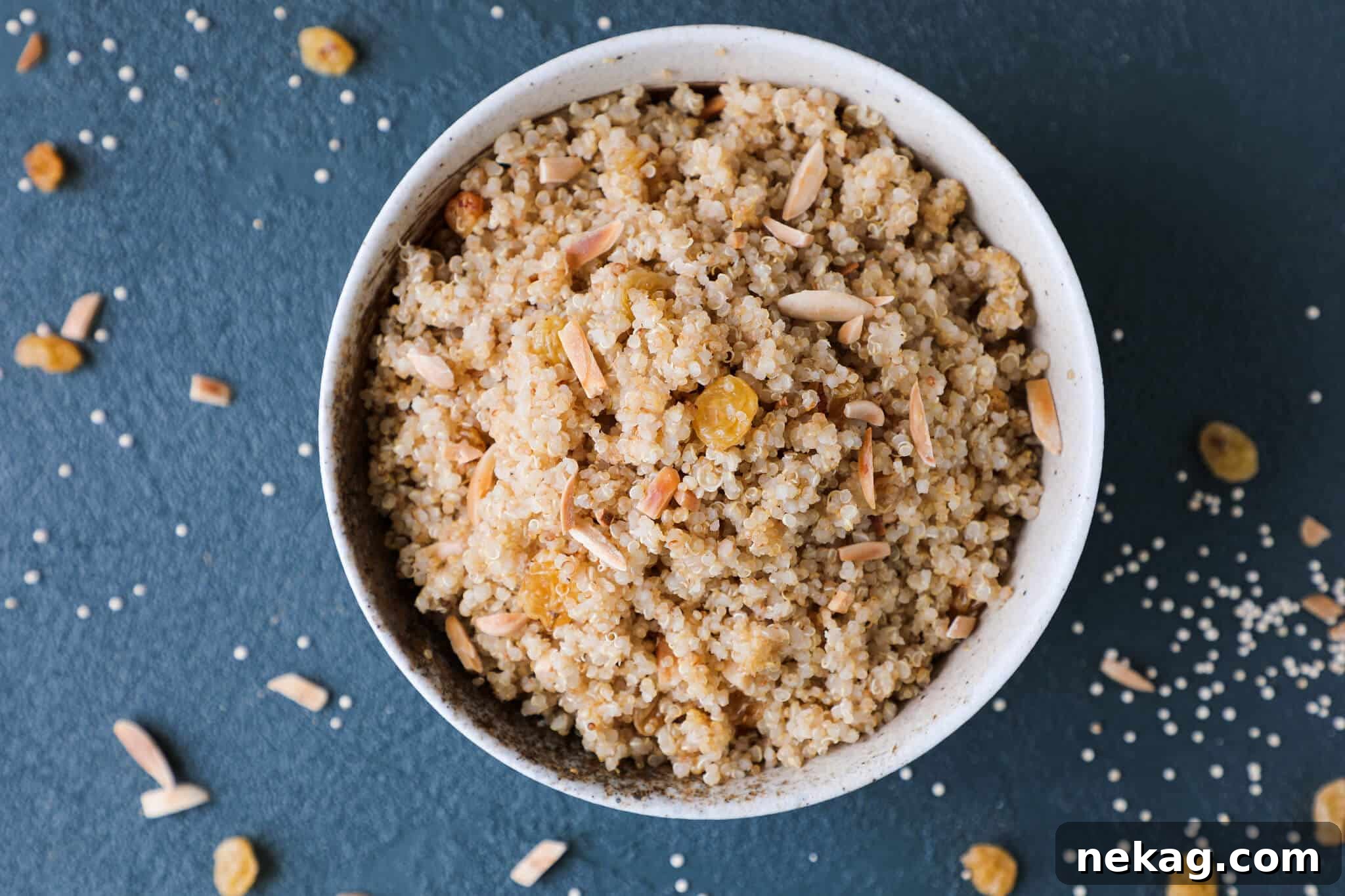 Close-up of fluffy Quinoa Pilaf garnished with toasted slivered almonds, highlighting its inviting texture and appetizing presentation
